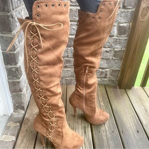 Brown suede knee-high boots with high heel